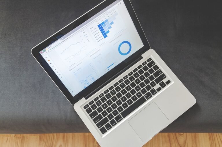 Laptop showing campaign performance charts — Facebook Ads analytics